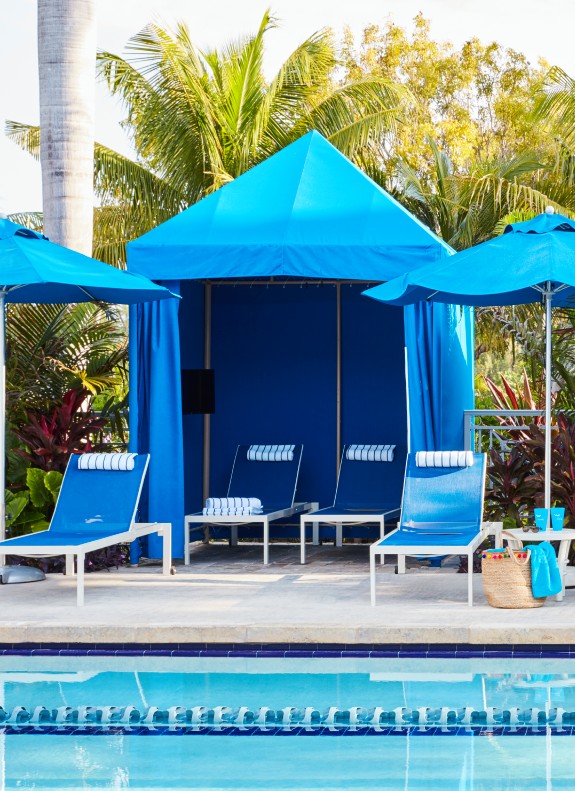 Resort lifestyle photo of little girl in the pool enjoying scuba diving lessons